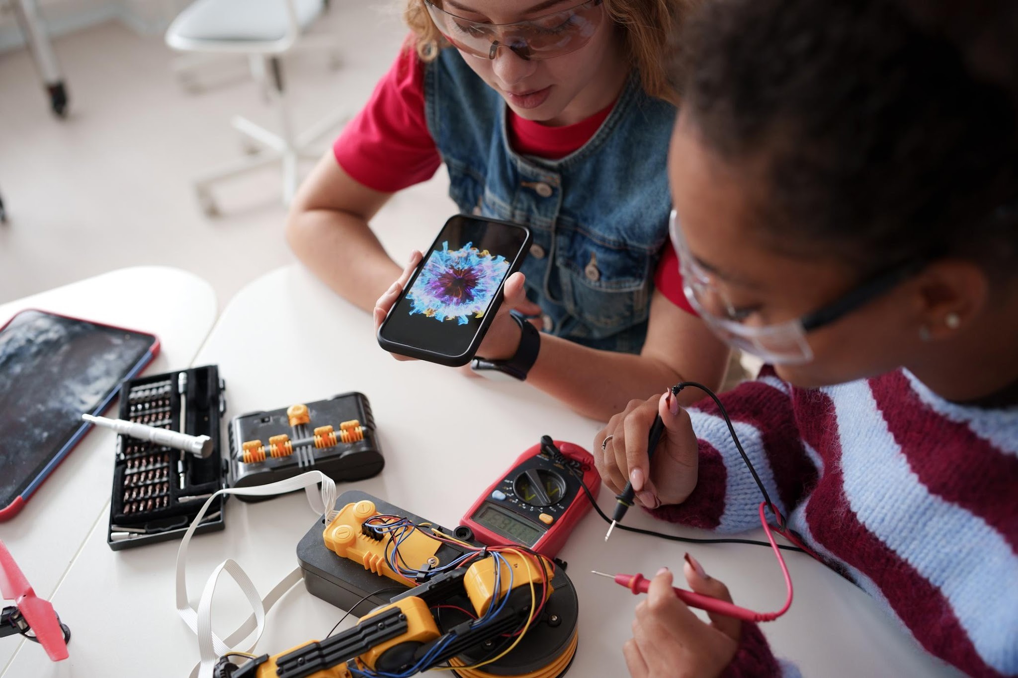 Children working together on robotics components