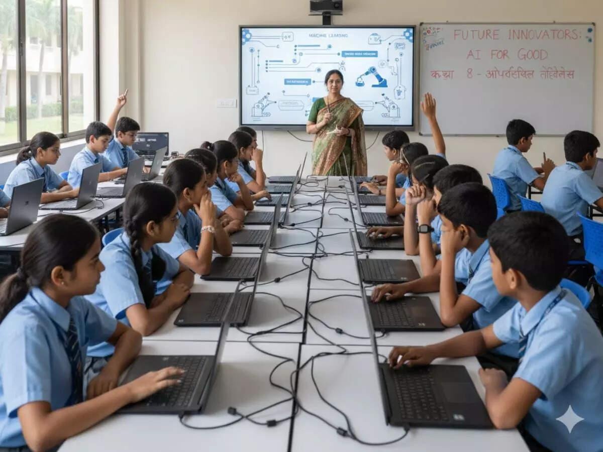 Students working on laptops in a computer lab with teacher at the front