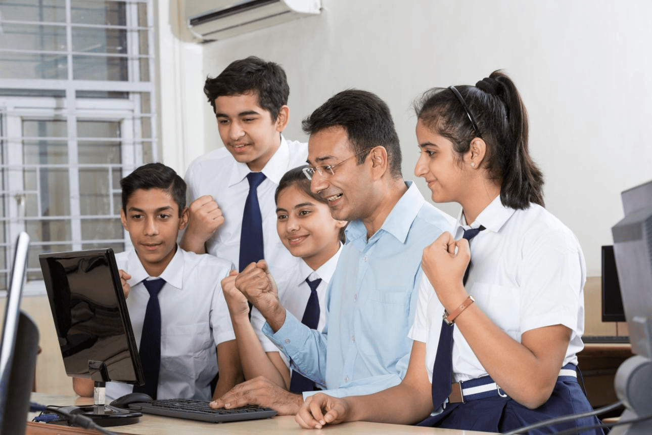 Students gathered around a screen showing AI graphics